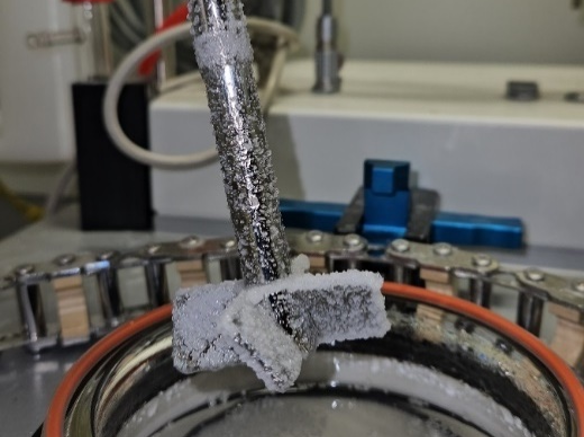 Crystalliser impeller heavily encrusted with white scale after conventional operation